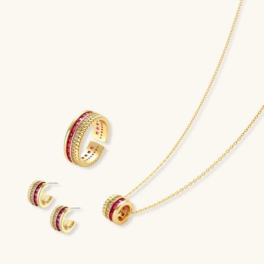 Gold jewelry set with pink gemstones and diamond accents, featuring necklace, earrings, and ring for elegant gifting.