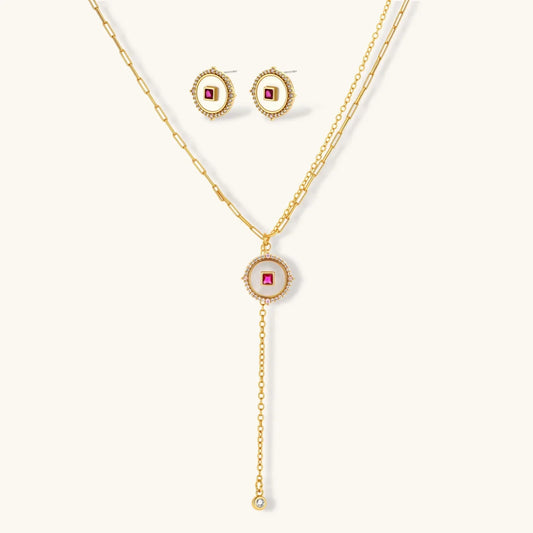 Gold lariat necklace and matching stud earrings with pink gemstone and crystal accents, elegant jewelry set