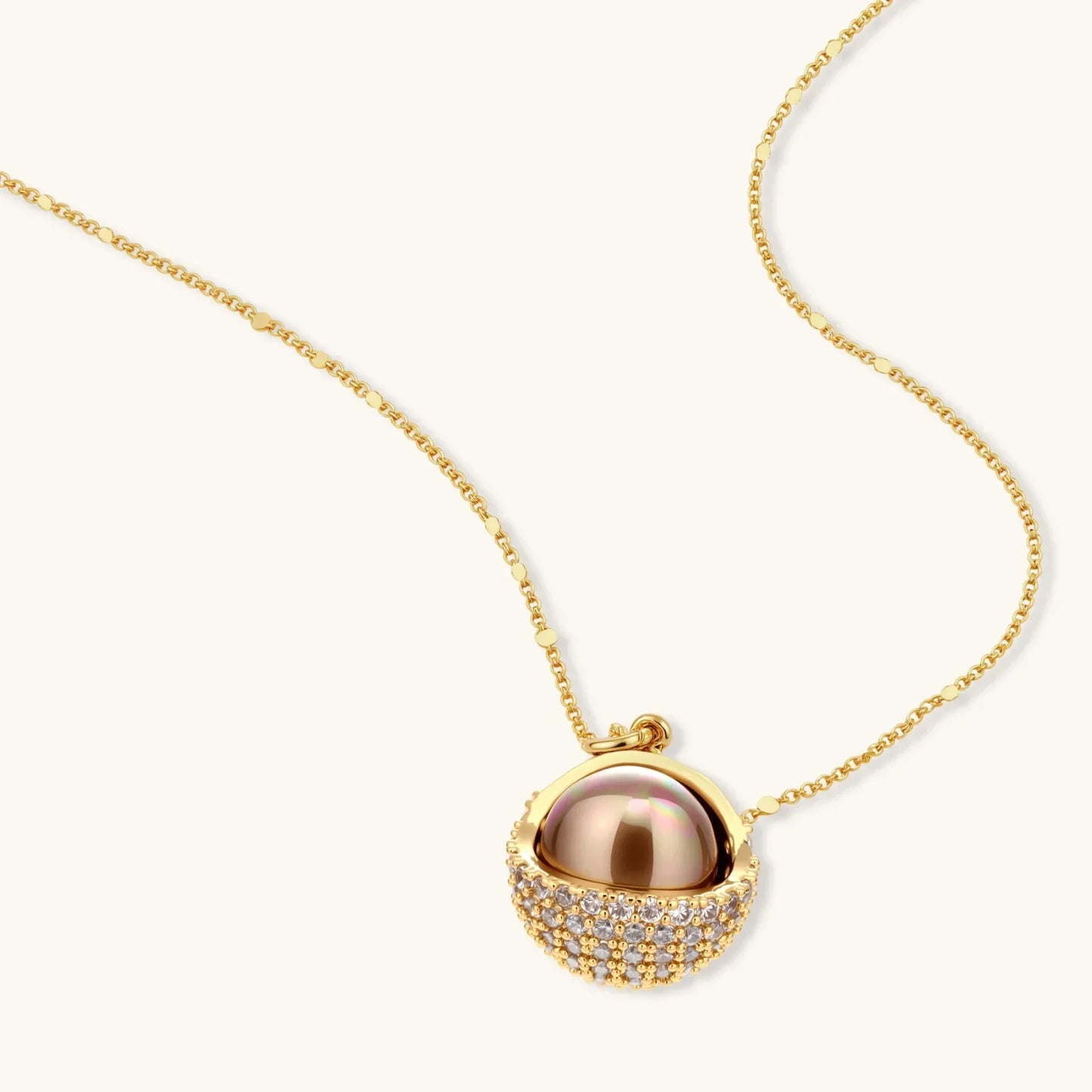 Gold necklace with pearl pendant and crystal accents, elegant women's jewelry