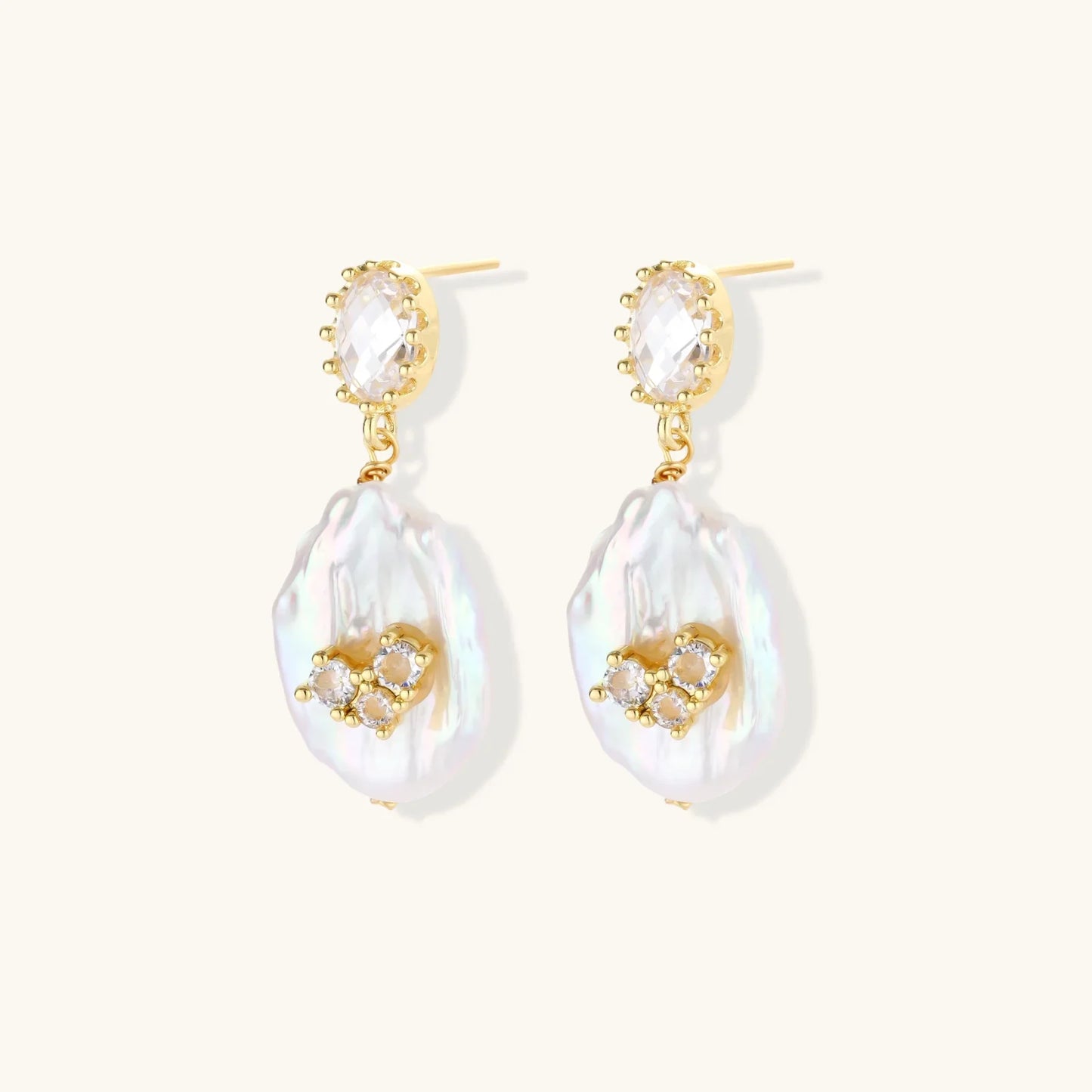 Elegant gold drop earrings with pearl-like teardrop pendants and crystal accents, perfect for stylish home décor gifts.