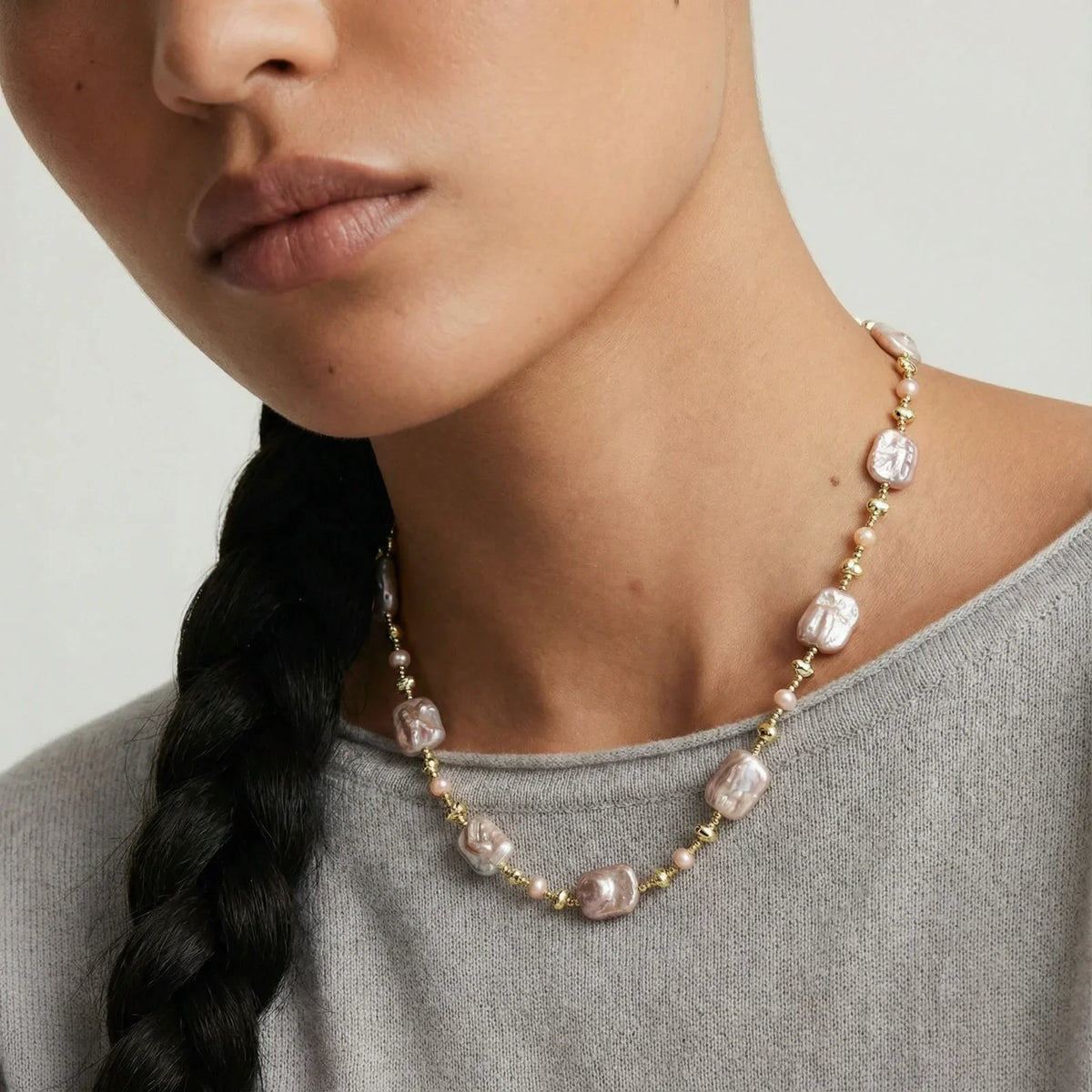 Elegant pink baroque pearl necklace with gold beads, styled for modern home décor gifting