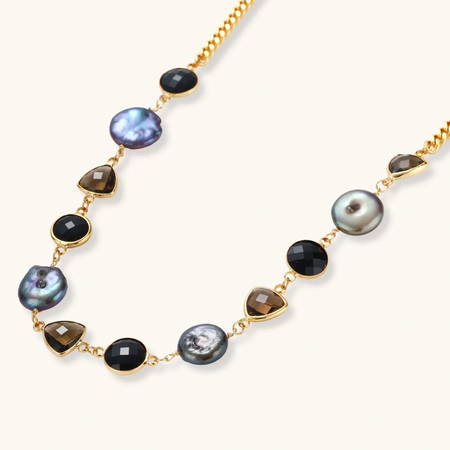 Elegant gold chain necklace with black onyx, smoky quartz, and iridescent pearl beads for luxury home décor gifting