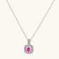 Sterling silver jewelry set featuring pink moissanite stones in halo settings on white background.