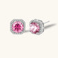 Sterling silver jewelry set featuring pink moissanite stones in halo settings on white background.