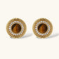 Gold stud earrings with tiger's eye center and diamond halo, luxury jewelry for elegant style.