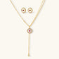 Gold lariat necklace and matching stud earrings with pink gemstone and crystal accents, elegant jewelry set