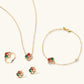 Gold flower jewelry set with colorful gemstones: necklace, bracelet, ring, and earrings for elegant gifting