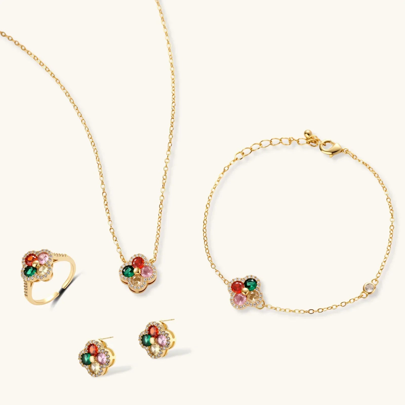 Gold flower jewelry set with colorful gemstones: necklace, bracelet, ring, and earrings for elegant gifting