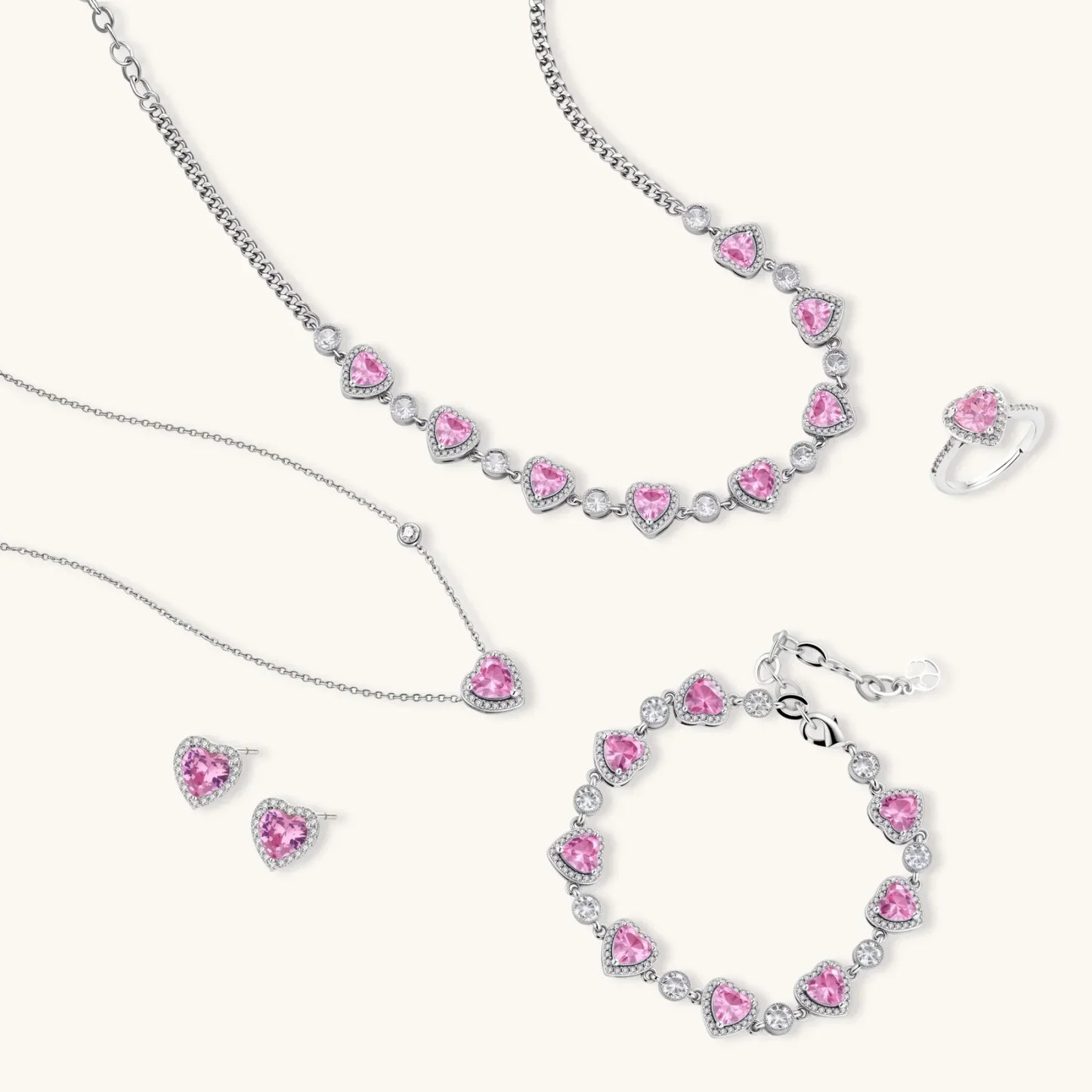 Pink heart crystal jewelry set with necklace, bracelet, earrings, and ring for elegant gifting
