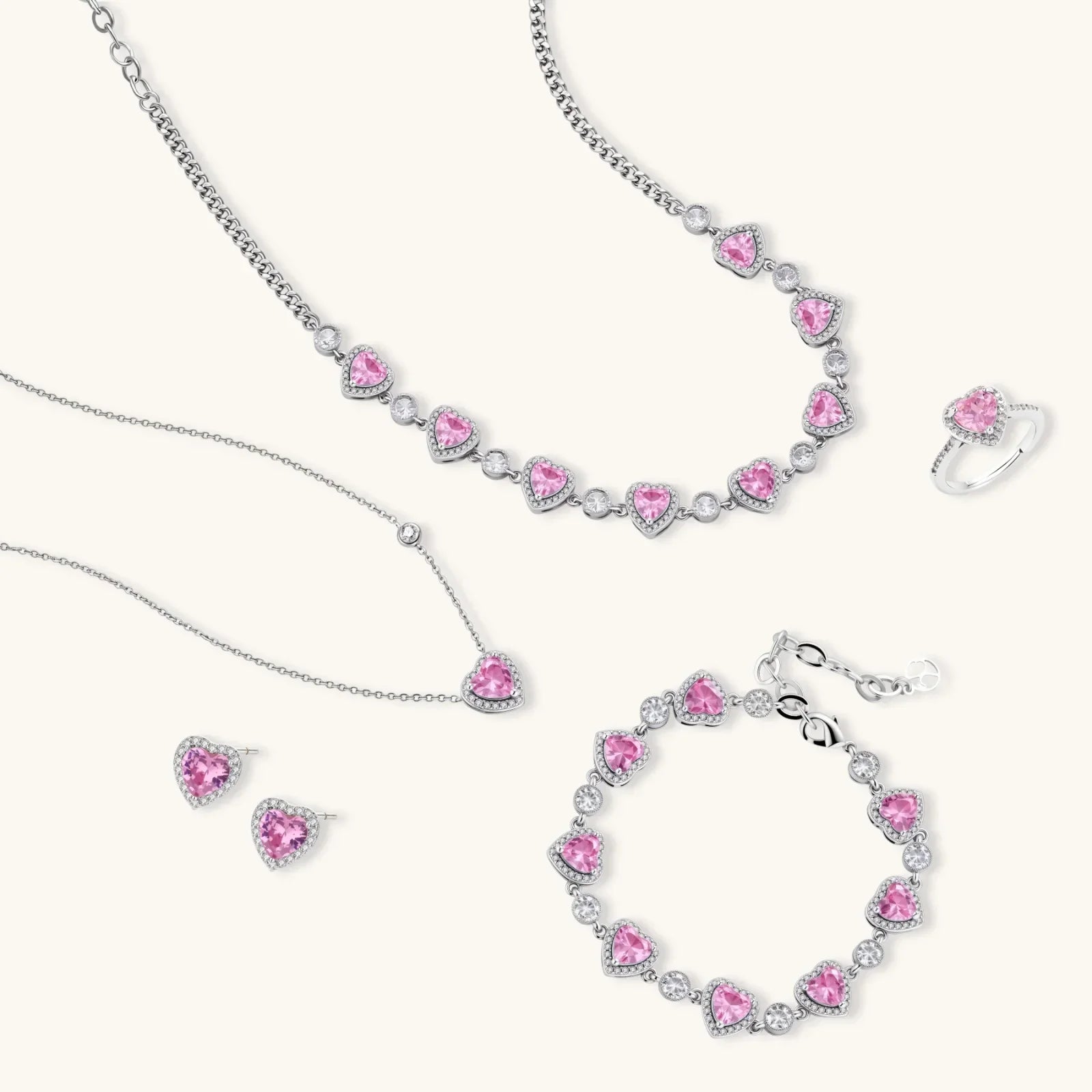 Pink heart crystal jewelry set with necklace, bracelet, earrings, and ring for elegant gifting