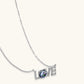 Silver 'LOVE' pendant necklace with sparkling crystal and diamond accents, elegant gift for her