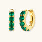 Gold hoop earrings with emerald green gemstones, elegant statement jewelry for women