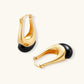 Gold hoop earrings with black enamel drop, modern minimalist design for elegant everyday wear