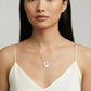 Elegant pearl pendant necklace on woman, minimalist silver disc design, perfect for stylish home décor gifts