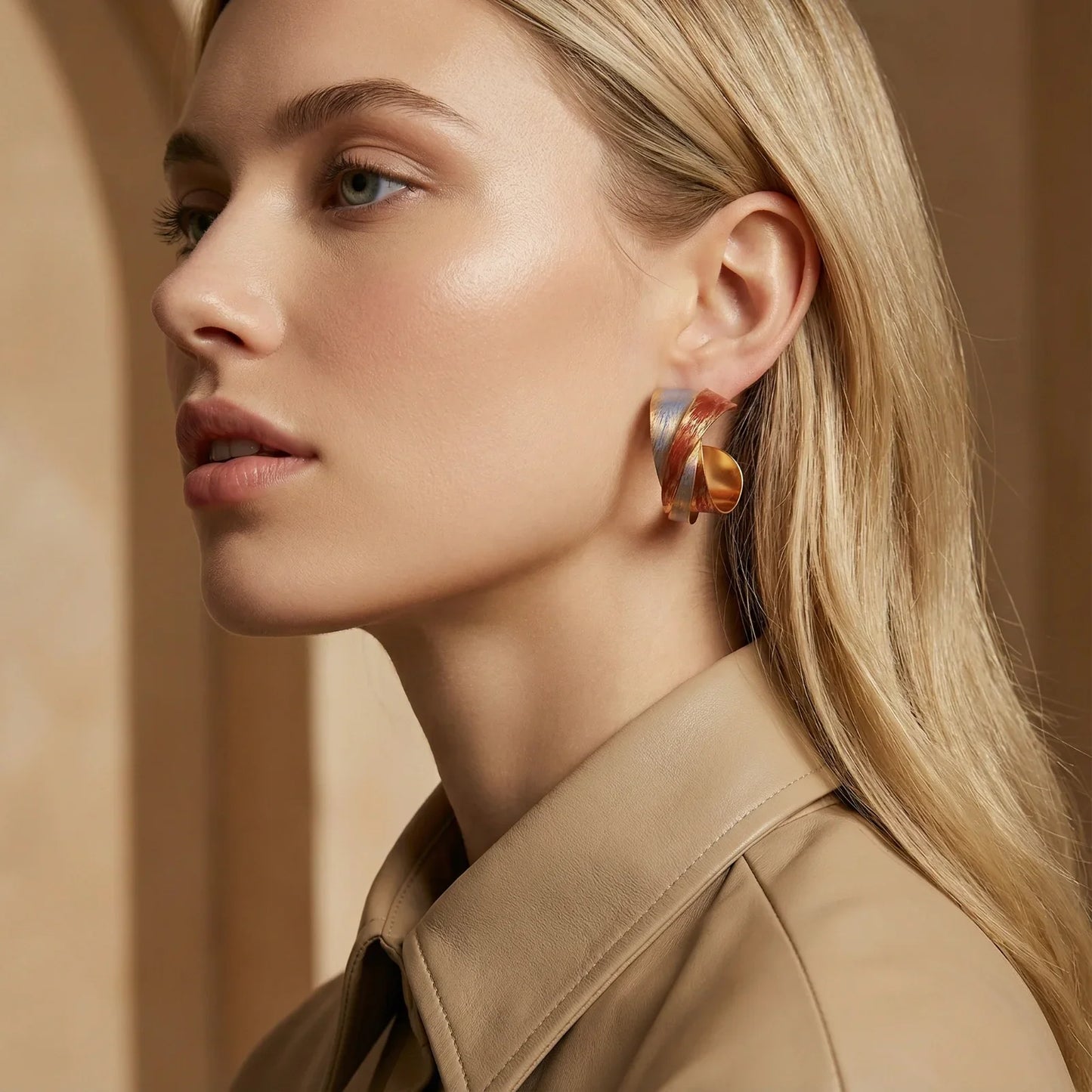 Stylish gold and silver hoop earrings on blonde woman, modern fashion accessory