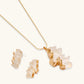 Gold-tone necklace and matching earrings with wavy, frosted glass pendant for modern home décor styling