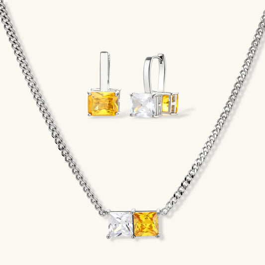 Silver necklace and earrings set with yellow and clear square gemstones, elegant jewelry for women