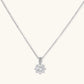 Platinum-plated sterling silver necklace with round clear crystal pendant and decorative bail on neutral background.