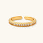 Gold open ring with textured band and sparkling crystal row, elegant accessory for styled homes