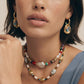 Layered beaded necklace with gold hoops and colorful gemstones, perfect for stylish home décor gifting.