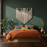 Modern bedroom with artisan home decor, orange bedding, macrame wall hanging, indoor plants