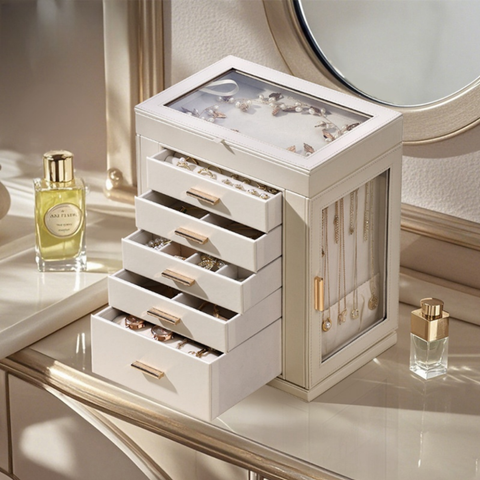 Elegant multi-drawer jewelry organizer for home decor on mirrored vanity with perfume bottles.