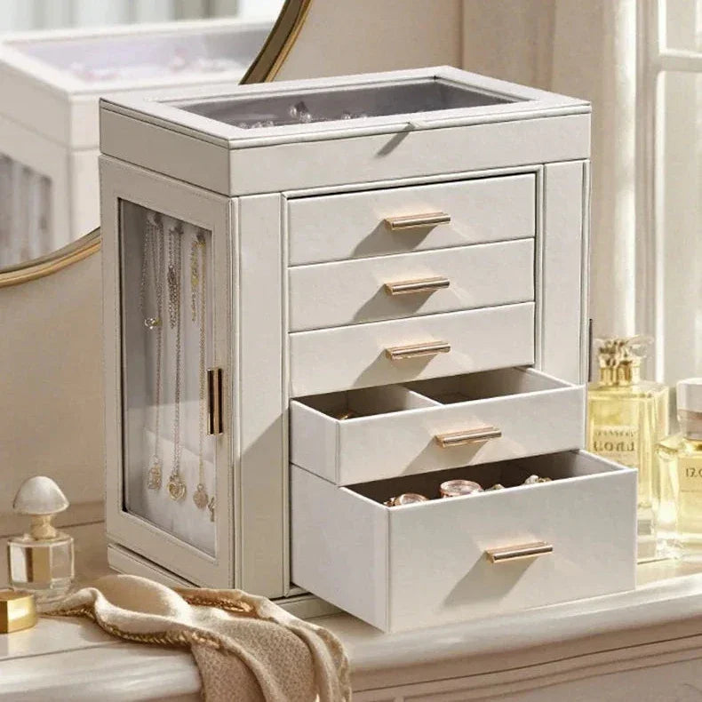 Elegant white jewelry box with gold handles and glass side panels on a vanity, Fansee Australia decor