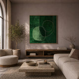 Modern living room with a green abstract painting on the wall, beige sofa, and round coffee table.
