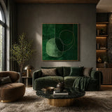 Modern living room with a green sofa, round coffee table, and abstract green artwork on the wall.