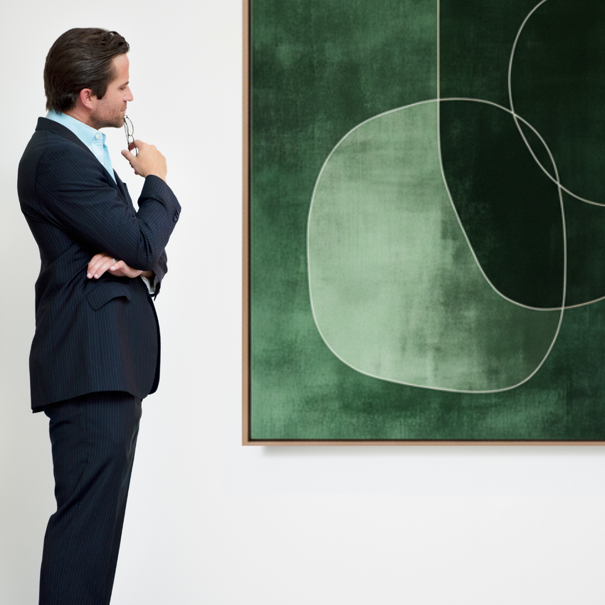 Man in suit admiring modern green abstract wall art, artisan home decor by Fansee Australia