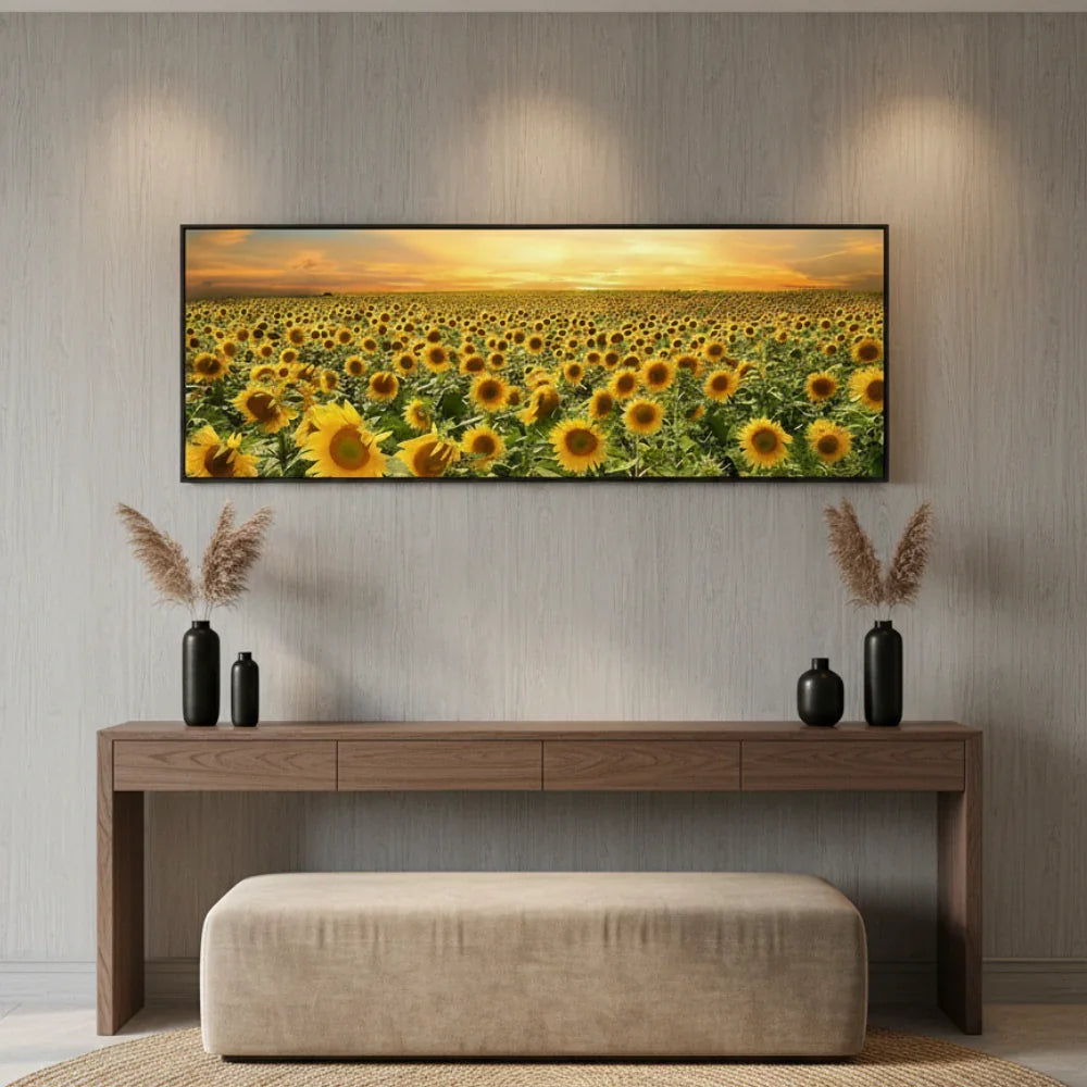 Sunflower field wall art above modern console table with black vases and beige ottoman in stylish home decor