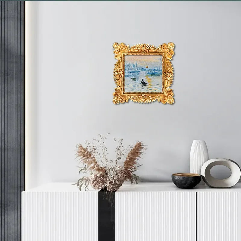 Modern living room with gold-framed art, minimalist decor, and white cabinet from Fansee Australia