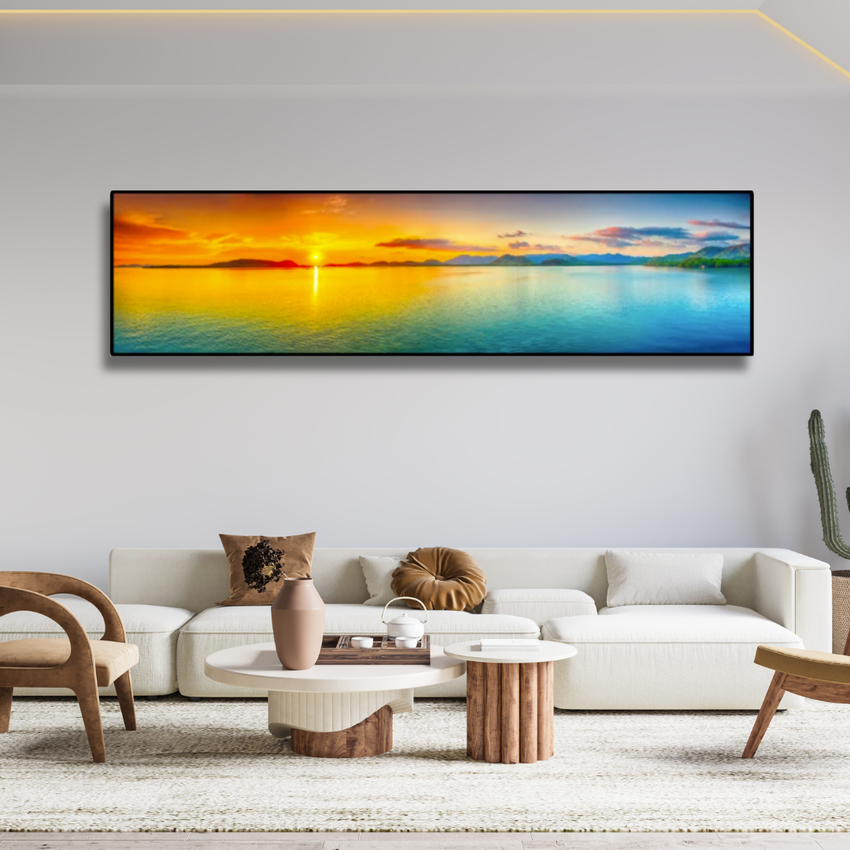 Modern living room with artisan decor and large framed sunset ocean artwork on wall