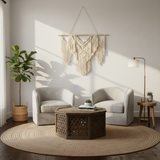 Modern artisan home decor living room with macrame wall art, round rug, and handcrafted furniture
