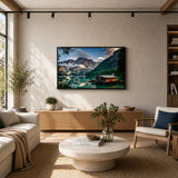 Modern living room with green sofa, wall art of mountain lake landscape, stylish home decor