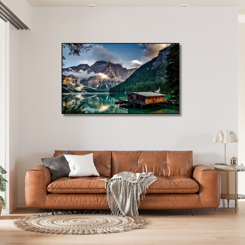 Contemporary living room with brown leather sofa, cozy throw, and mountain lake wall art, Fansee Australia decor