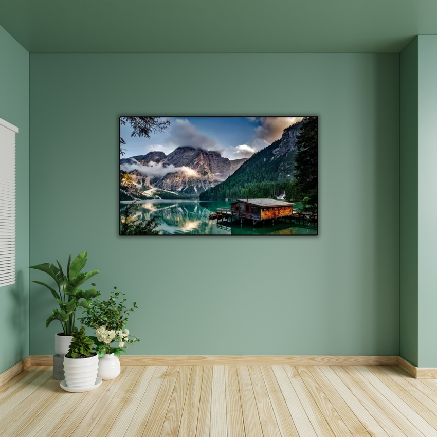 Framed mountain landscape wall art in modern green living room with potted plants, Fansee Australia decor