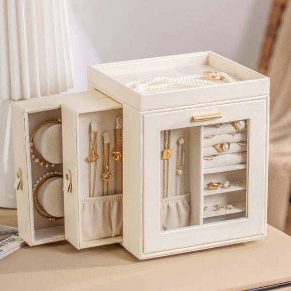Elegant cream jewelry organizer box with gold and pearl jewelry, artisan home decor accent