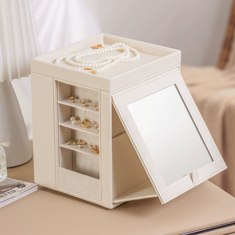 Elegant cream jewelry box with mirror, pearl necklace, and gold earrings on vanity, Fansee Australia