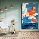 Modern living room with abstract blue and orange wall art, white chair, and wooden decor.