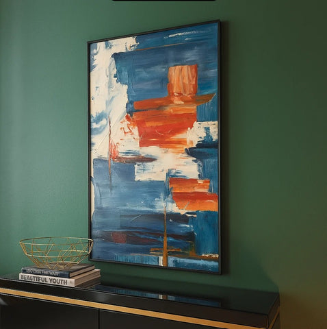 Modern abstract wall art with blue and orange brushstrokes in stylish home decor setting