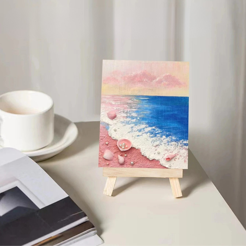 Mini pink beach and blue ocean textured painting with shells on a small easel, artisan decor