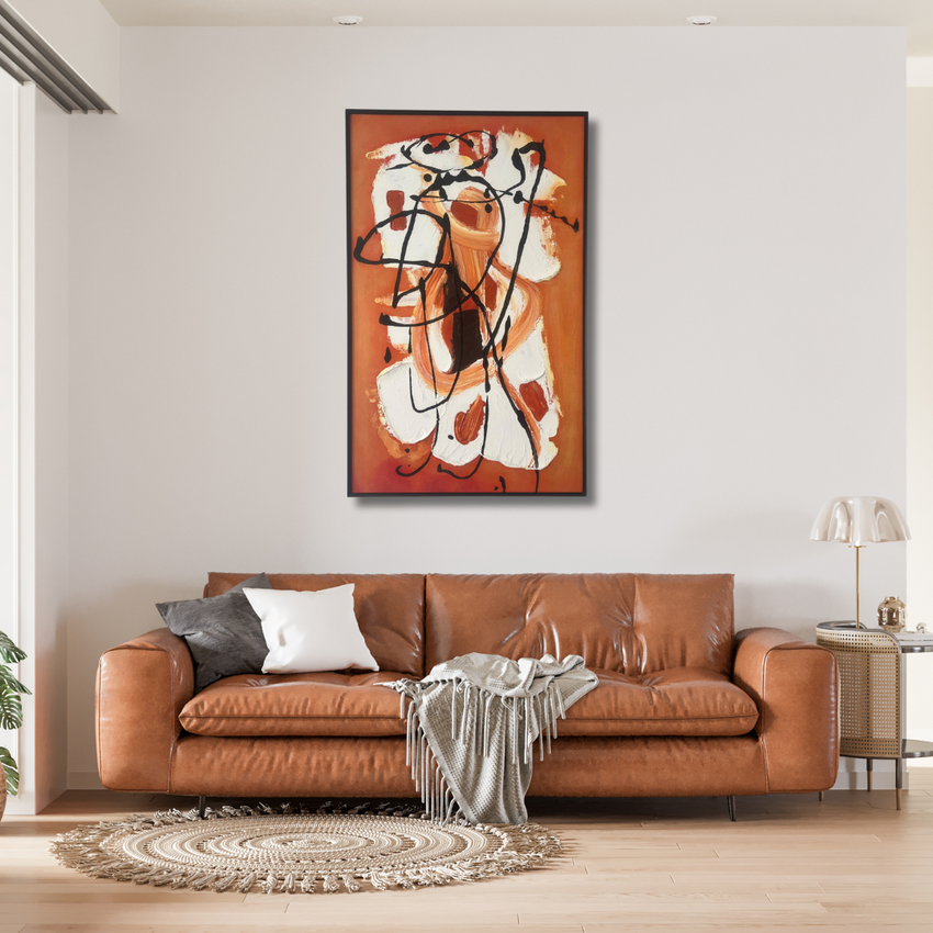 Modern living room with brown leather sofa, abstract orange wall art, and artisan home decor.
