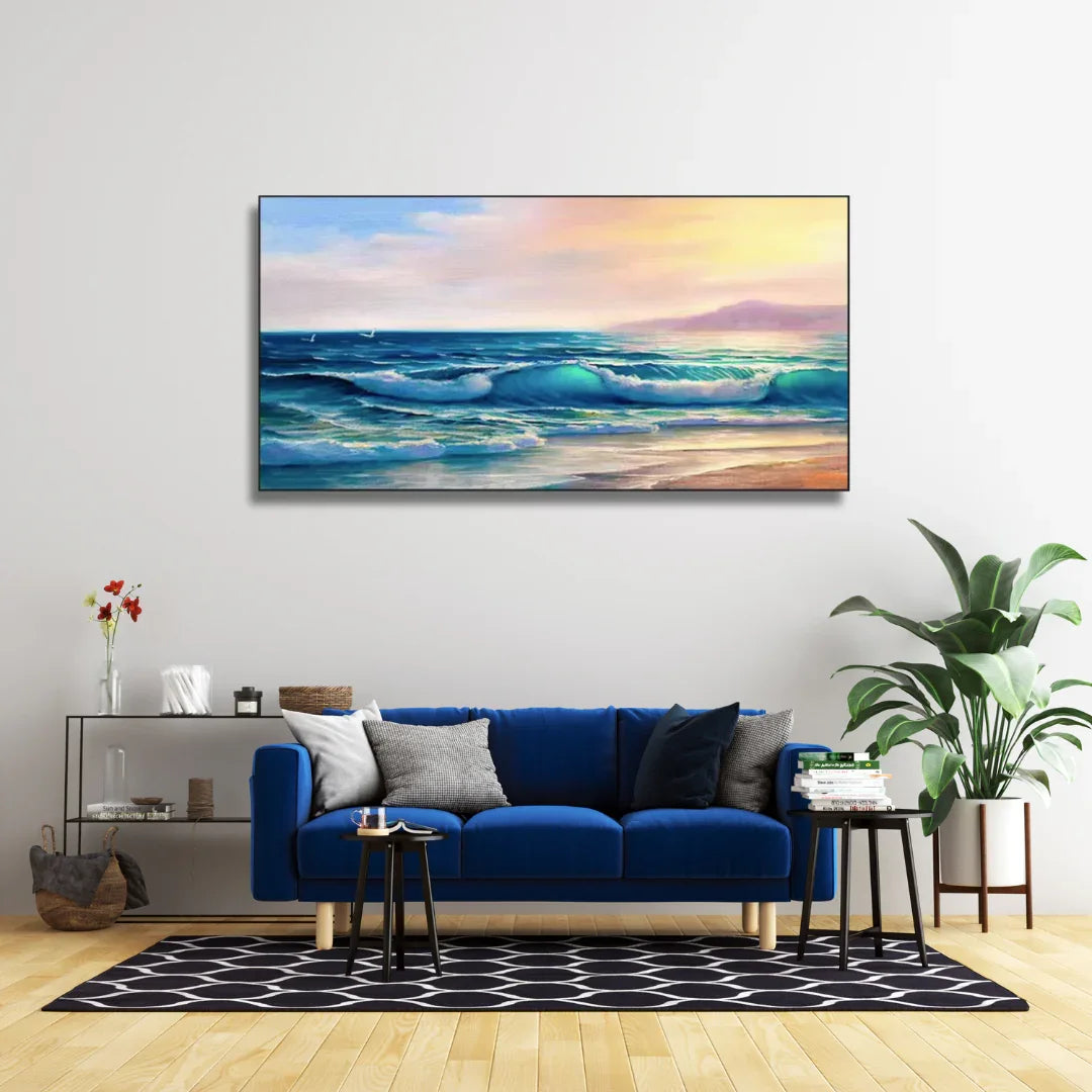 Modern living room with blue sofa, ocean sunset wall art, and minimalist home decor